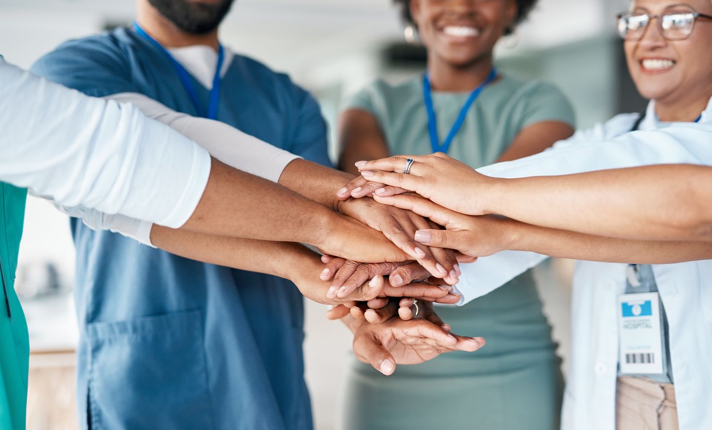 Healthcare colleagues joining hands